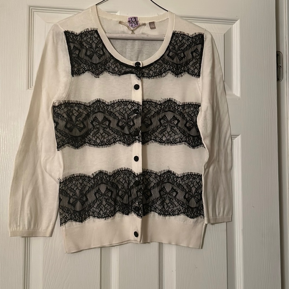 Black and White anthropology blouse size medium.